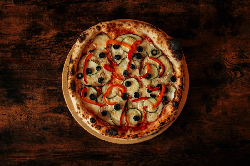 Warm Nutella dessert pizza with fresh strawberries and powdered sugar